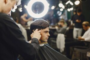 stylish-man-sitting-in-a-barbershop-2024-04-15-18-54-52-utc